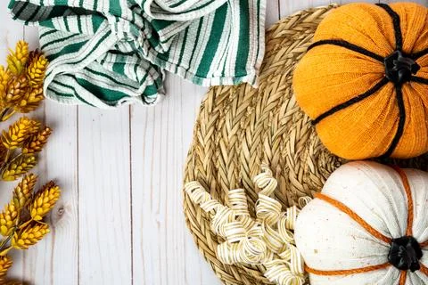 Pretty fall autumn flat lay, with fabric pumpkins, dried flowers, and towel.. Stock Photos
