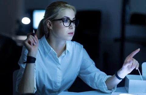 Pretty female hacker breaking into the computer system Stock Photos