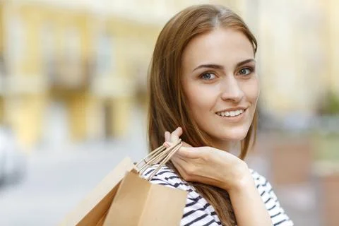 Pretty female smiling, while posing for camera Stock Photos