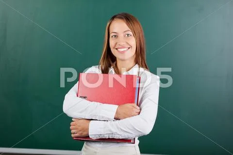 Pretty female student with binder Stock Photos