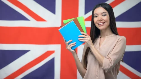 Pretty female student showing copybooks ... | Stock Video | Pond5