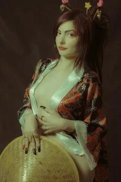 Pretty geisha with hat Stock Photos
