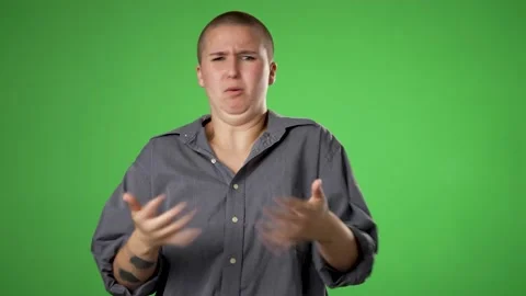 Pretty gender fluid non binary woman 20s pointing fingers herself ask say who me Video stock 221917664