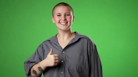 Pretty gender fluid non binary young woman 20s turn around look at camera Stock Footage 223260950