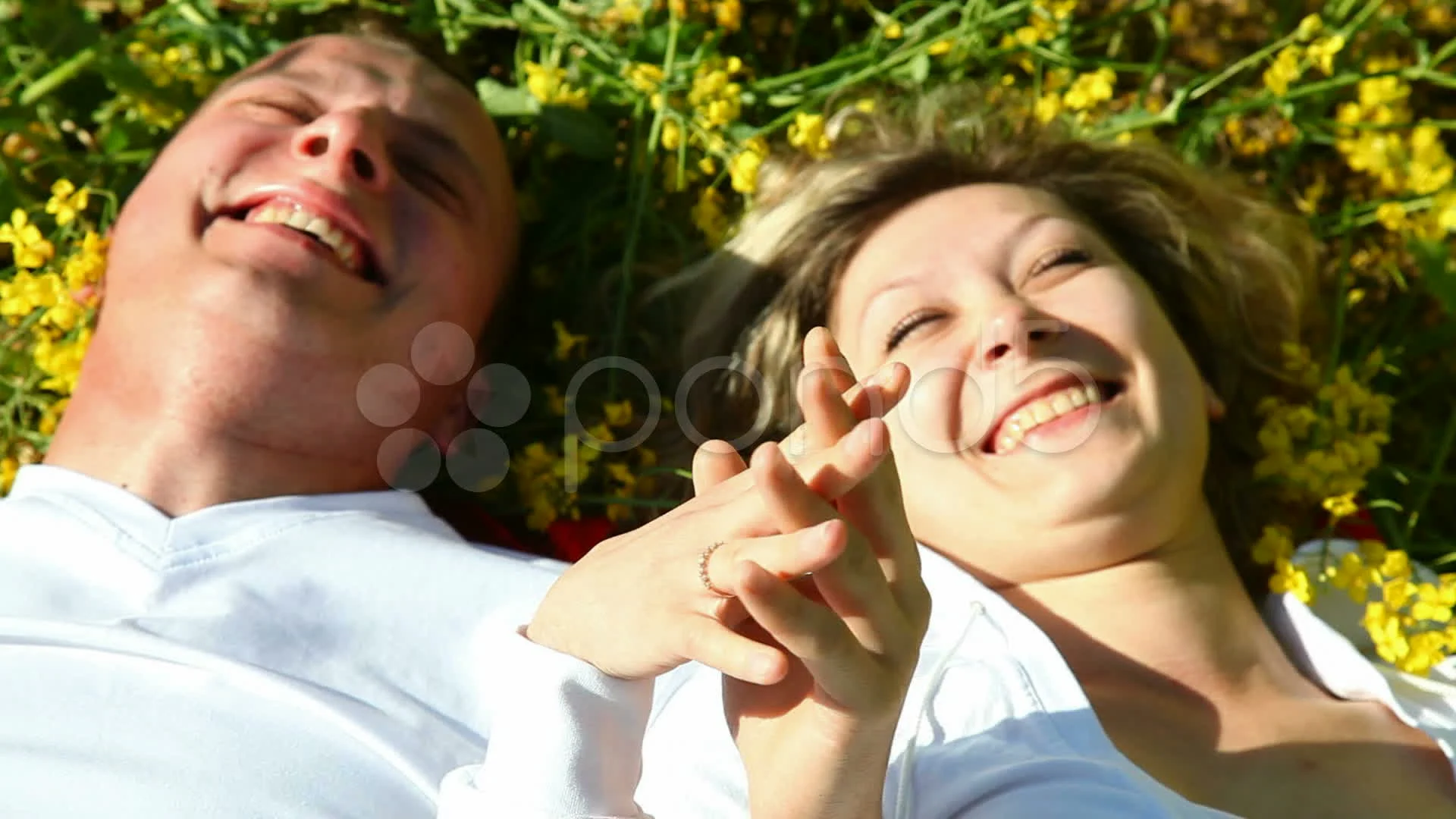 Pretty girl and boy in a rape field, vie... | Stock Video | Pond5