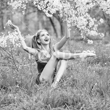 Pretty girl in blossom Stock Photos