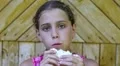 Pretty girl eats slice of white bread HD Footage