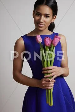 Pretty girl with floweers Stock Photos