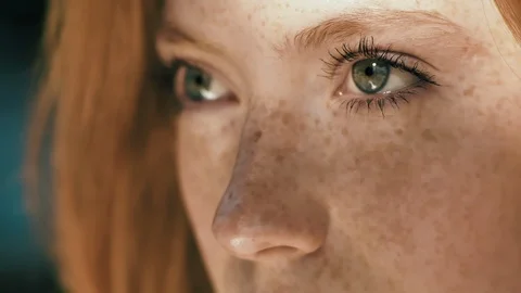 Pretty girl with freckles woman’s eyes opening while looking at Camera Stock Footage