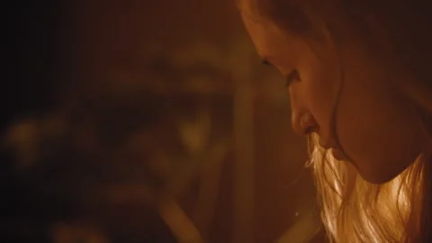 Pretty girl looks down while playing piano Stock Footage 275718048