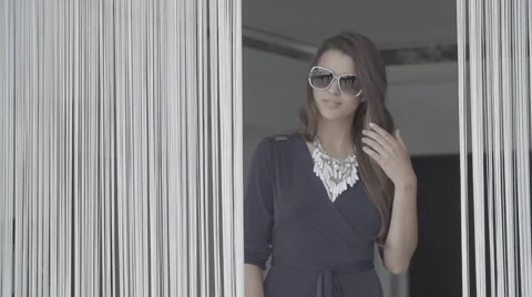 Pretty girl model posing to camera sunglasses slow motion Stock Footage 68709426