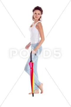 Pretty girl posing with color umbrella on white background Stock Photos