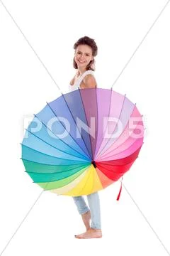 Pretty girl posing with color umbrella on white background Stock Photos