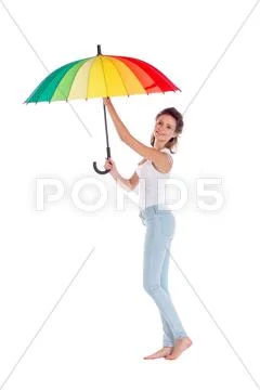 Pretty girl posing with color umbrella on white background Stock Photos