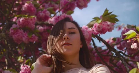 Pretty Girl Posing Under The Cherry Blossom Tree During Spring In Paris, Stock Footage 236620902