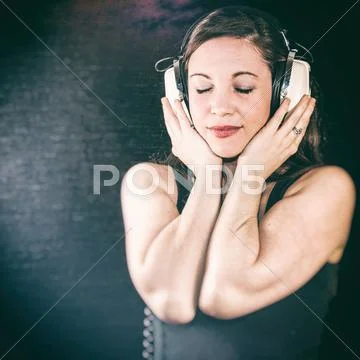 Pretty Girl With Retro Headphones Listening