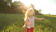 Pretty Girl Running On Grass And Smiling Stock Footage