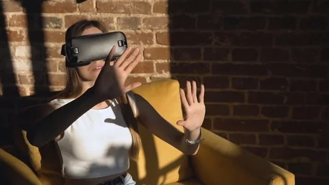Pretty Girl Sets Virtual Reality Glasses Stock Footage