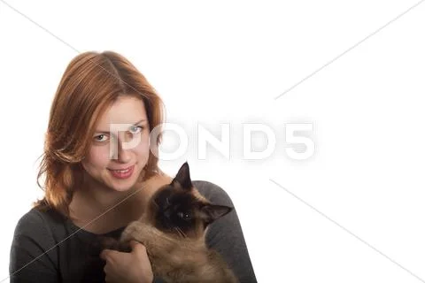 Pretty girl with a siamese cat Stock Photos