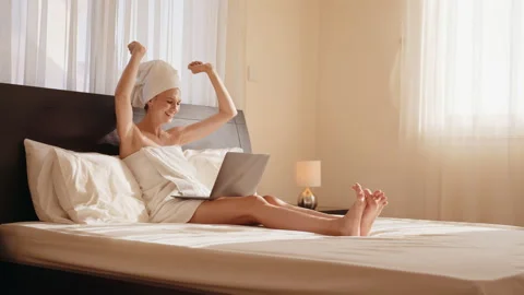 Pretty girl sit on sofa read email use laptop feel happy. Student got Stock Footage 165471137