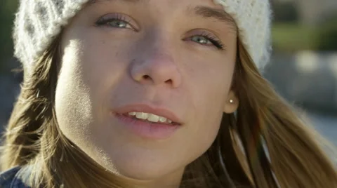 Pretty girl sitting by the river while in the city. Stock Footage 63032058