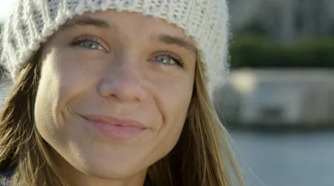 Pretty girl sitting by the river while in the city. Stock Footage 63032502