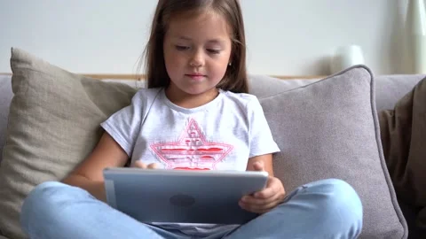 Pretty girl using digital table at home. Concept of modern device Stock Footage 139208621