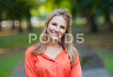 Pretty girl walking outdoors Stock Photos