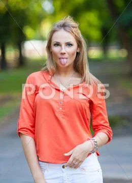 Pretty girl walking outdoors Stock Photos