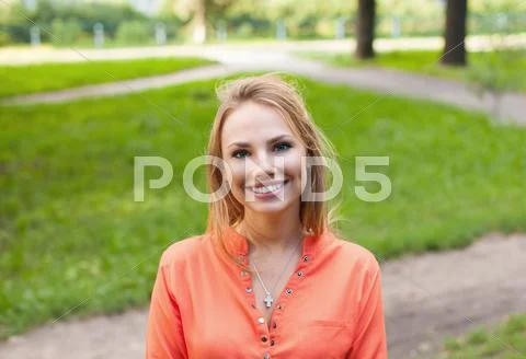 Pretty girl walking outdoors Stock Photos