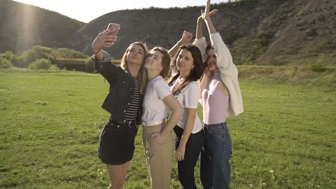 Pretty girlfriends making selfie Stock Footage 130473099