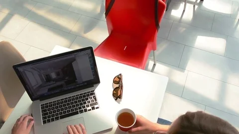 Pretty Girls Designers Using Laptop Computer and Drink Coffee Top View Видео 80458450