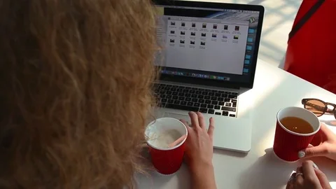 Pretty Girls Using Laptop Computer and Drink Coffee in Cafe. Top View Видео 80458452