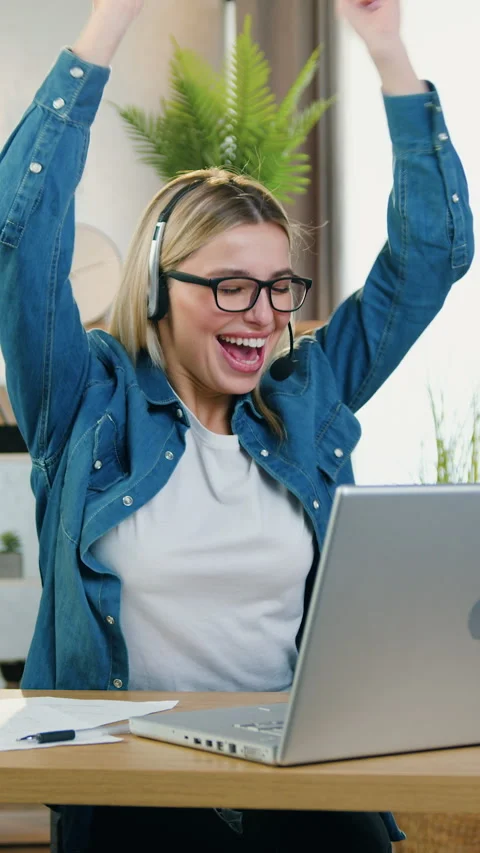 Pretty glad emotional 25-aged female person in eyeglasses and wireless headphone Stock Footage 325201385