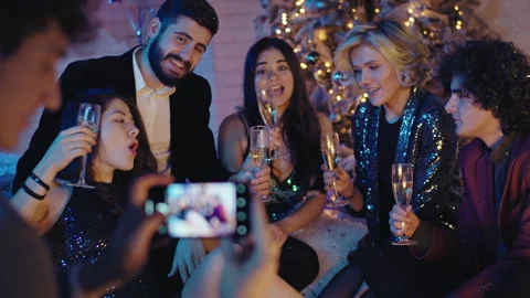 Pretty group of friends good looking ladies and guys celebrating new year Video stock 137115117