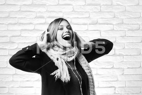 Pretty happy girl with headset Stock Photos