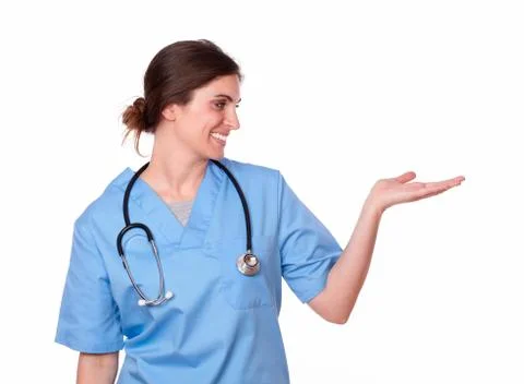 Pretty hispanic nurse standing with palms out Stock Photos