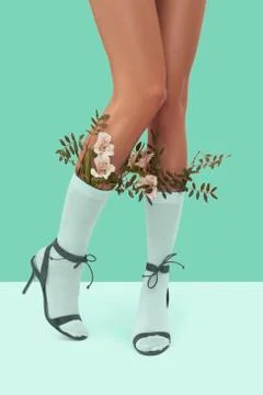 Pretty image on soft mint festive holiday content, long slim legs wearing white Stock Photos