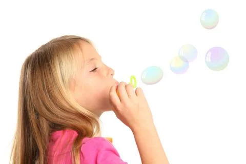 Pretty Kid Blowing Bubbles Stock Photos