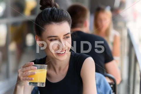 Pretty lady holding glass of lemonade Stock Photos