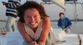 Pretty lady smiling at camera, enjoying rest on sailing yacht HD Footage