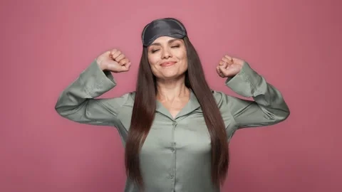 Pretty lady stretch arms hands health nap isolated pastel color background Stock Footage 166952816