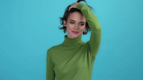 Pretty lady touch enjoy flawless hairstyle isolated blue color background Stock Footage 167084148