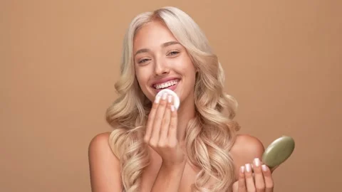 Pretty lady use sponge smooth cheeks rouge isolated pastel color background Stock Footage 166103766