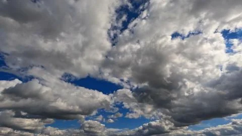 Pretty large bright clouds in the blue sky bg - photo of nature Stock Photos
