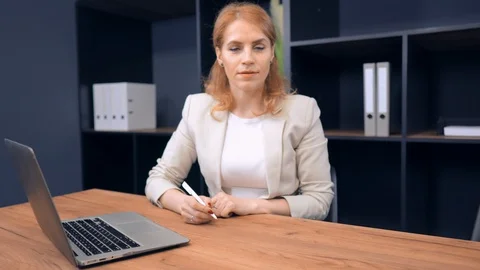 Pretty Middle-Aged Lady Doing her Work in Office Stock Footage 109135407