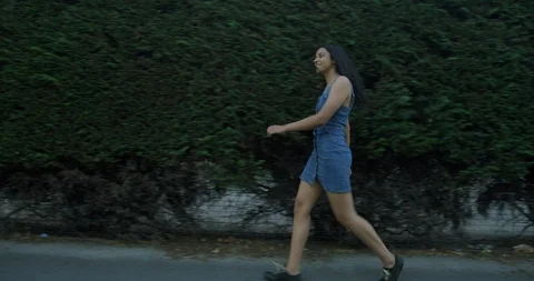 A Pretty Mix Race Young Student Girl Exploring The British Streets On Sunny day. Stock Footage 94531070