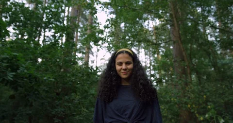 A Pretty Mix Race Young Student Girl Exploring The Woods on A Summers Day. Stock Footage 94535664