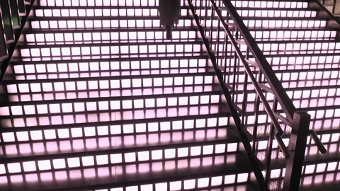 Pretty model coming down the luminous stairs in luxury restaurant or hotel. Stock Footage 106747267