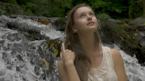 Pretty model in Hawaii - close up posing near waterfall 動画素材 37541193